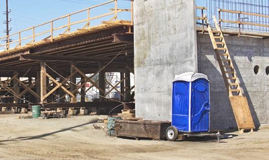 easily accessible portable toilets at a job site, saving workers from long walks to a permanent restroom